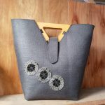 Women handbag with a wooden handle